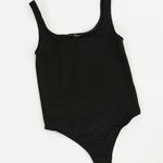 Black bodysuit on a white background