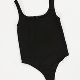 Black bodysuit on a white background