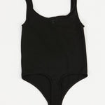 Black bodysuit on a white background
